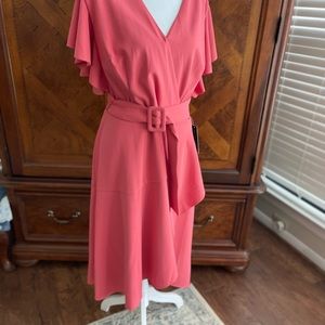 NWT coral colored dress size 14. Attached belt offers more adjustment.